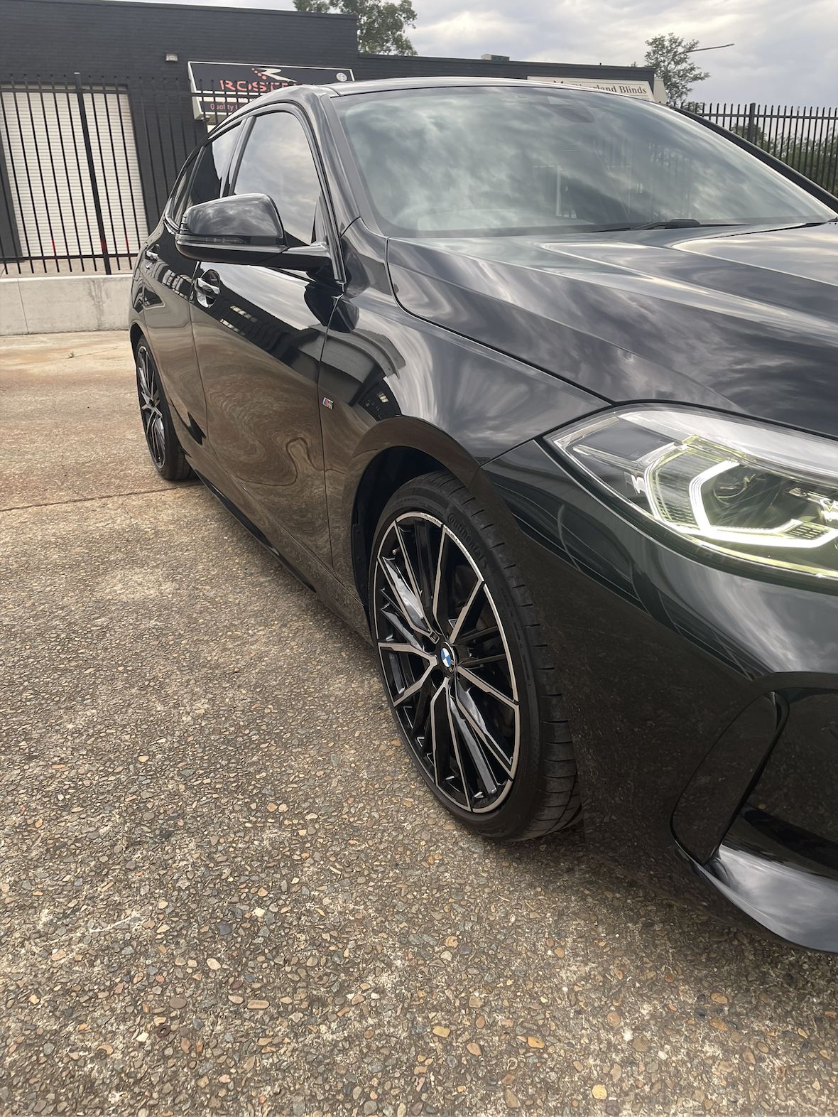 Black hatchback after a full detail