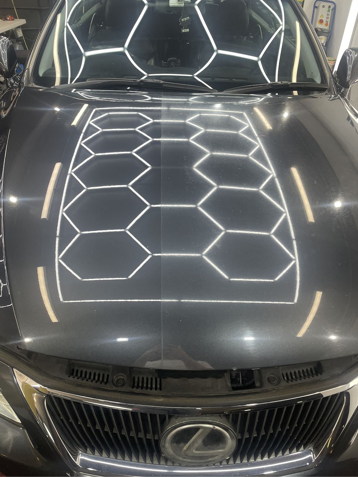 Lexus bonnet reflecting hexagon lights after paint correction